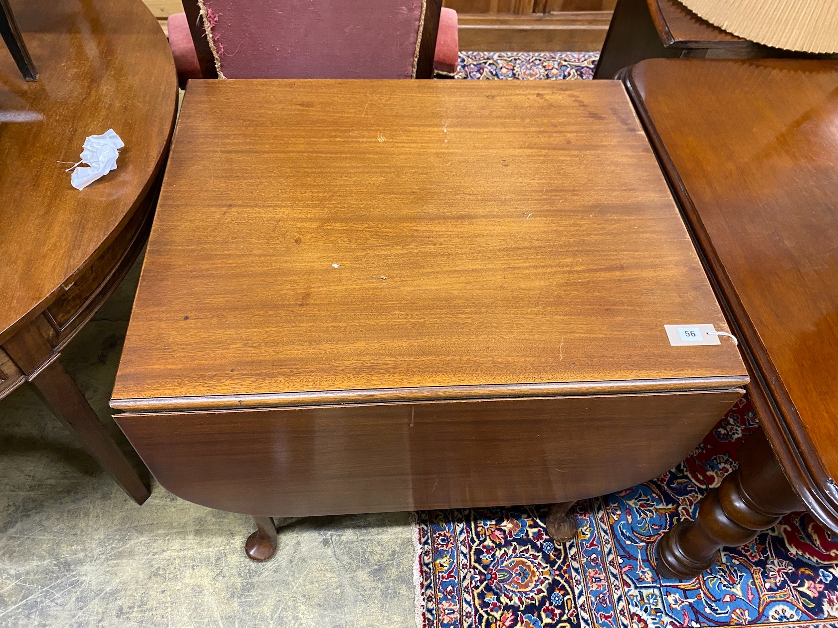 A 1920's mahogany drop flap dining table, width 83cm, depth 69cm, height 75cm
